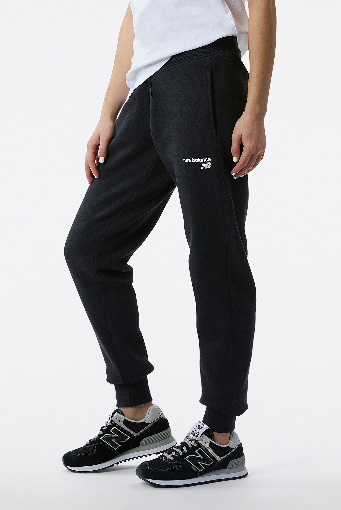 Женские черные спортивные брюки NB Classic CF Черный S New Balance WP03805BK Женские черные спортивные брюки NB Classic CF Черный S New Balance WP03805BK