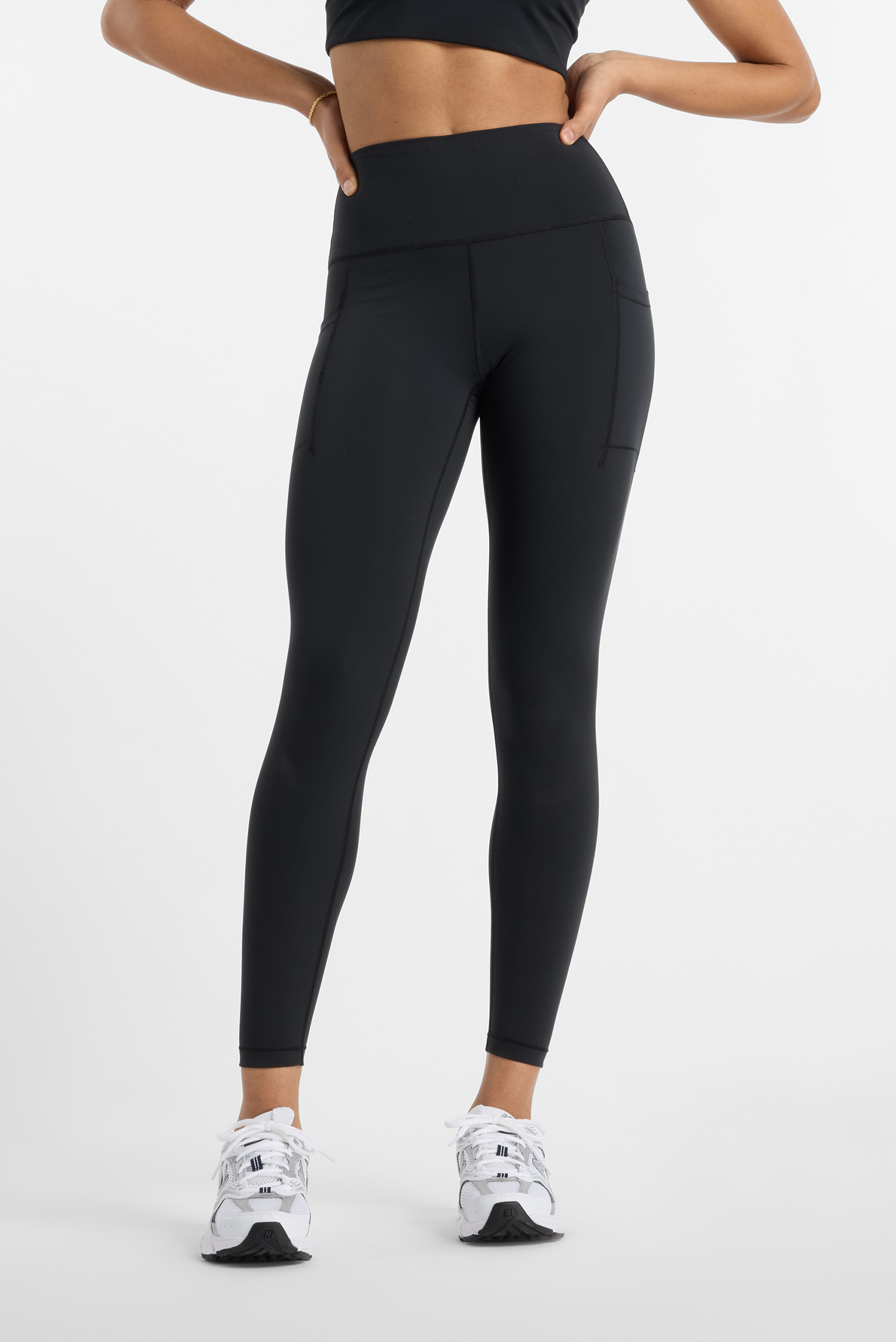 Женские черные тайтсы NB Sleek Pocket High Rise Legging 25" Черный XS New Balance WP51268BK Женские черные тайтсы NB Sleek Pocket High Rise Legging 25" Черный XS New Balance WP51268BK