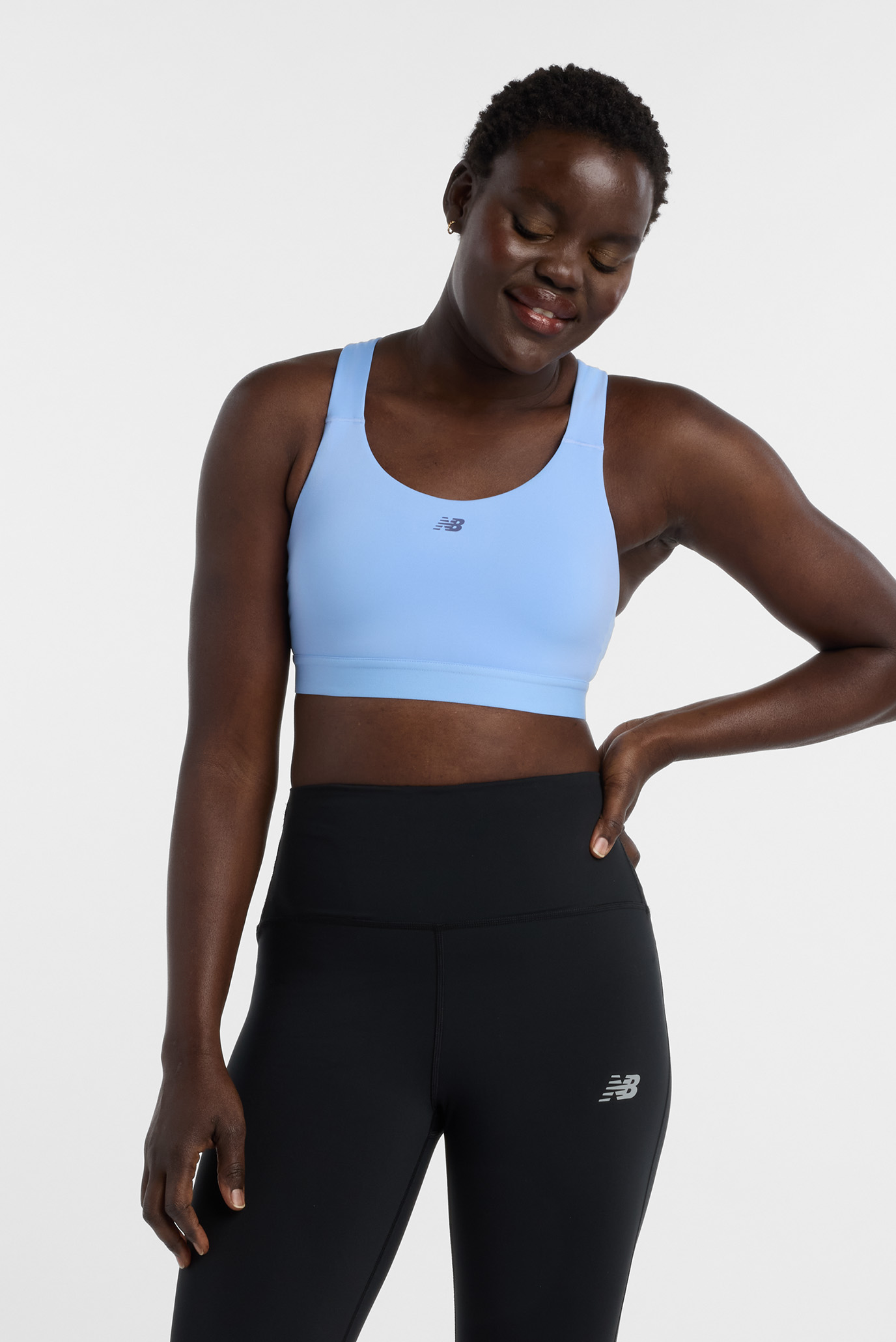 Женский голубой топ Essential Train Bra Голубой M New Balance WB51035ELE Женский голубой топ Essential Train Bra Голубой M New Balance WB51035ELE