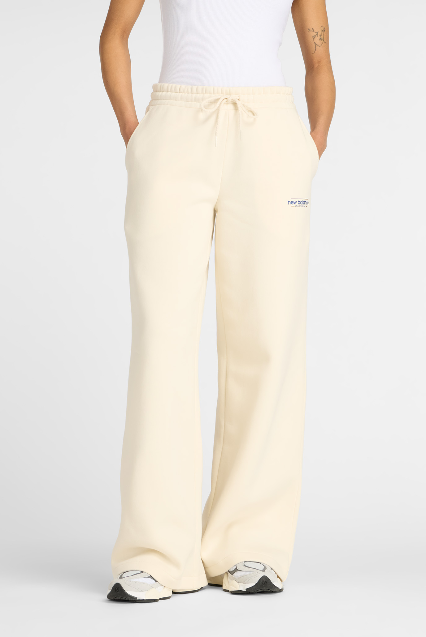 Женские бежевые брюки Reimagined Fleece Wide Leg Бежевый M New Balance WP53903LIN Женские бежевые брюки Reimagined Fleece Wide Leg Бежевый M New Balance WP53903LIN
