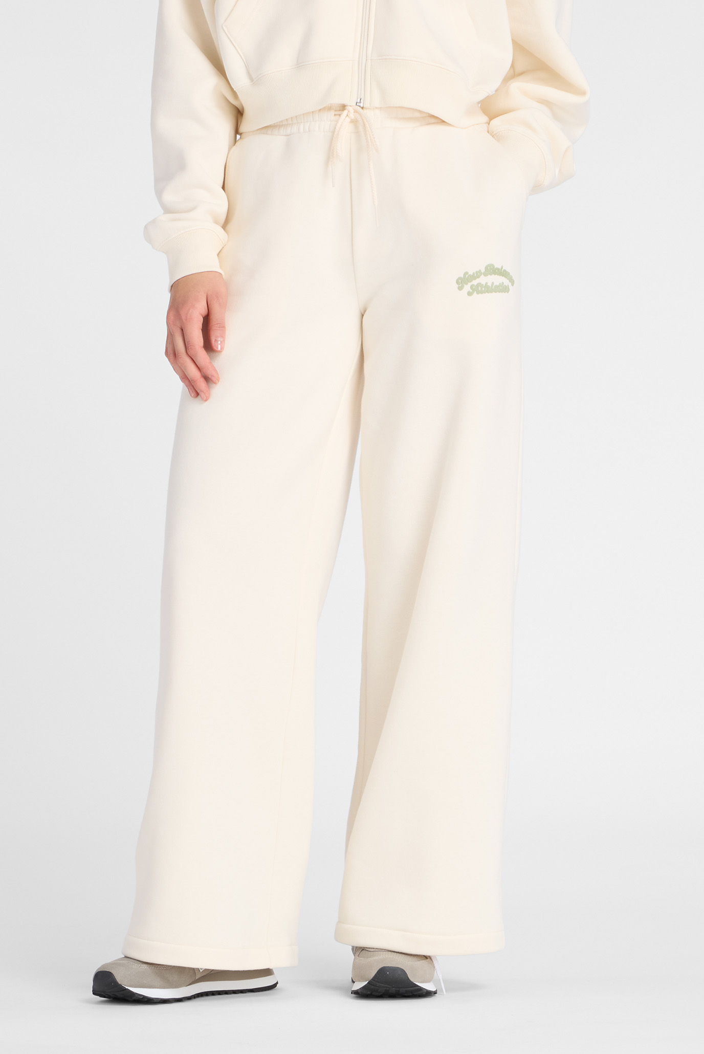 Женские бежевые брюки Linear Heritage Fleece Wide Leg Бежевый S New Balance WP53902PEF Женские бежевые брюки Linear Heritage Fleece Wide Leg Бежевый S New Balance WP53902PEF