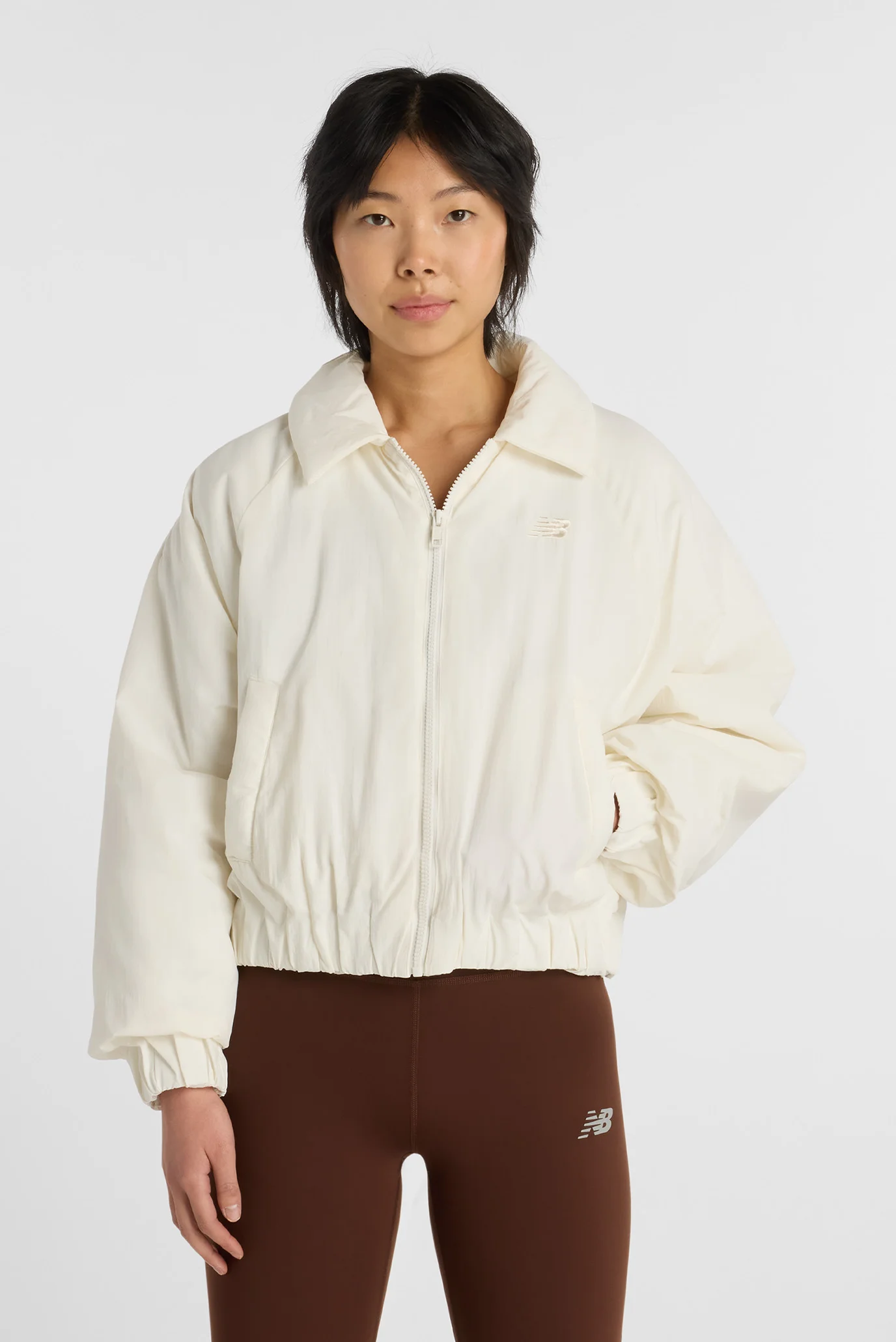 Женская бежевая куртка Woven Bomber Jacket New Balance WJ61D8YXSST